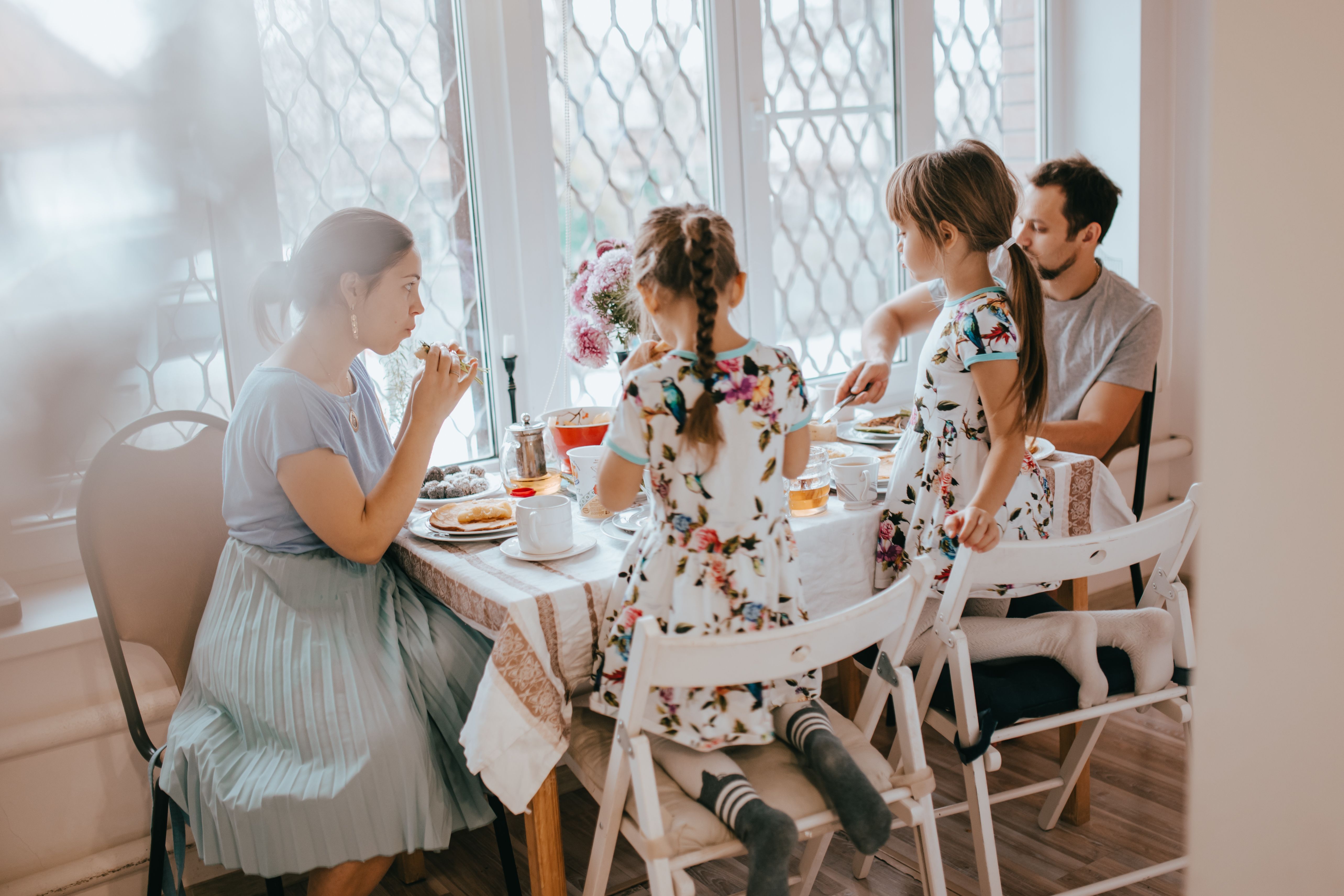 young family enjoying breakfast