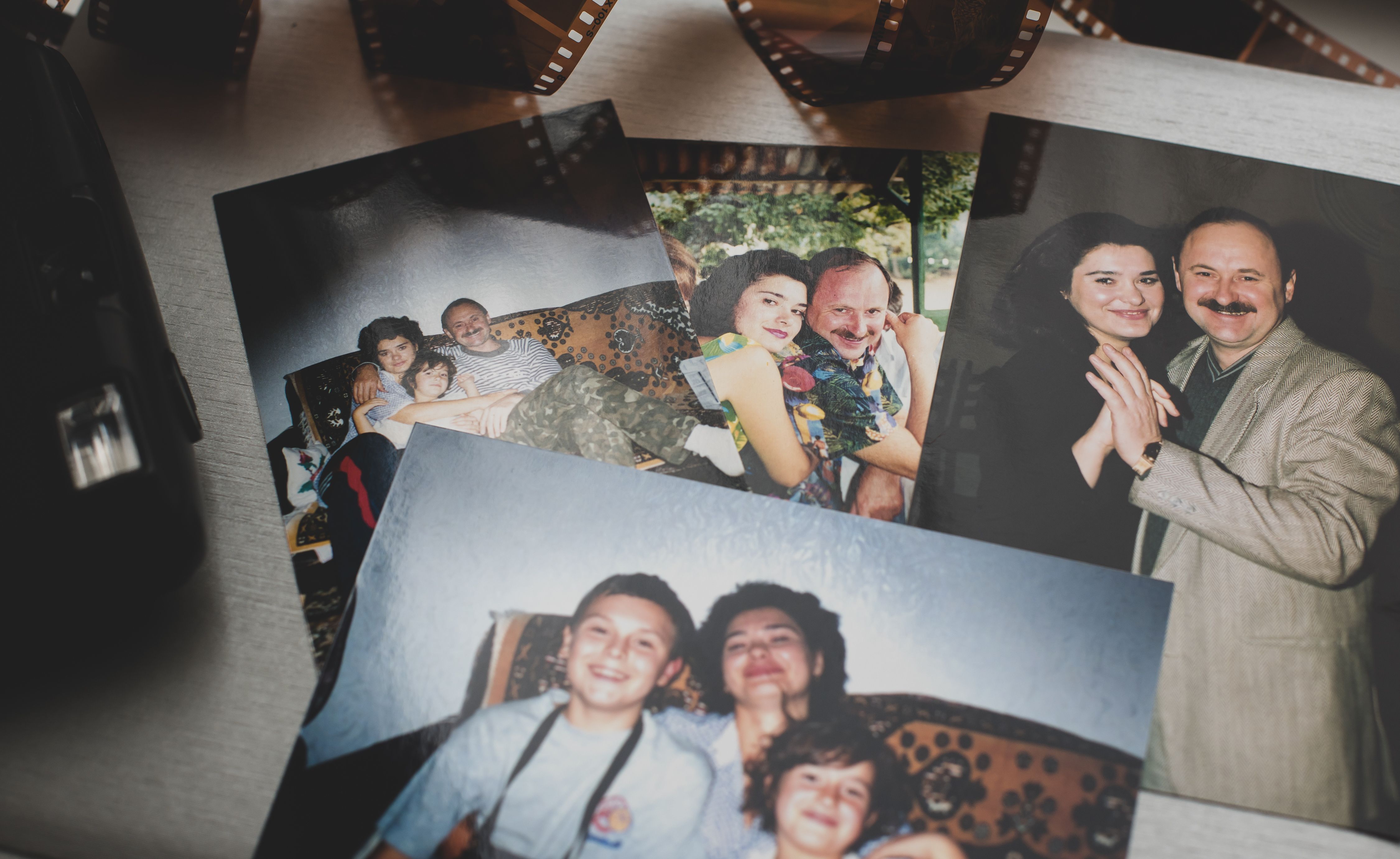 Family photos overlapping on table