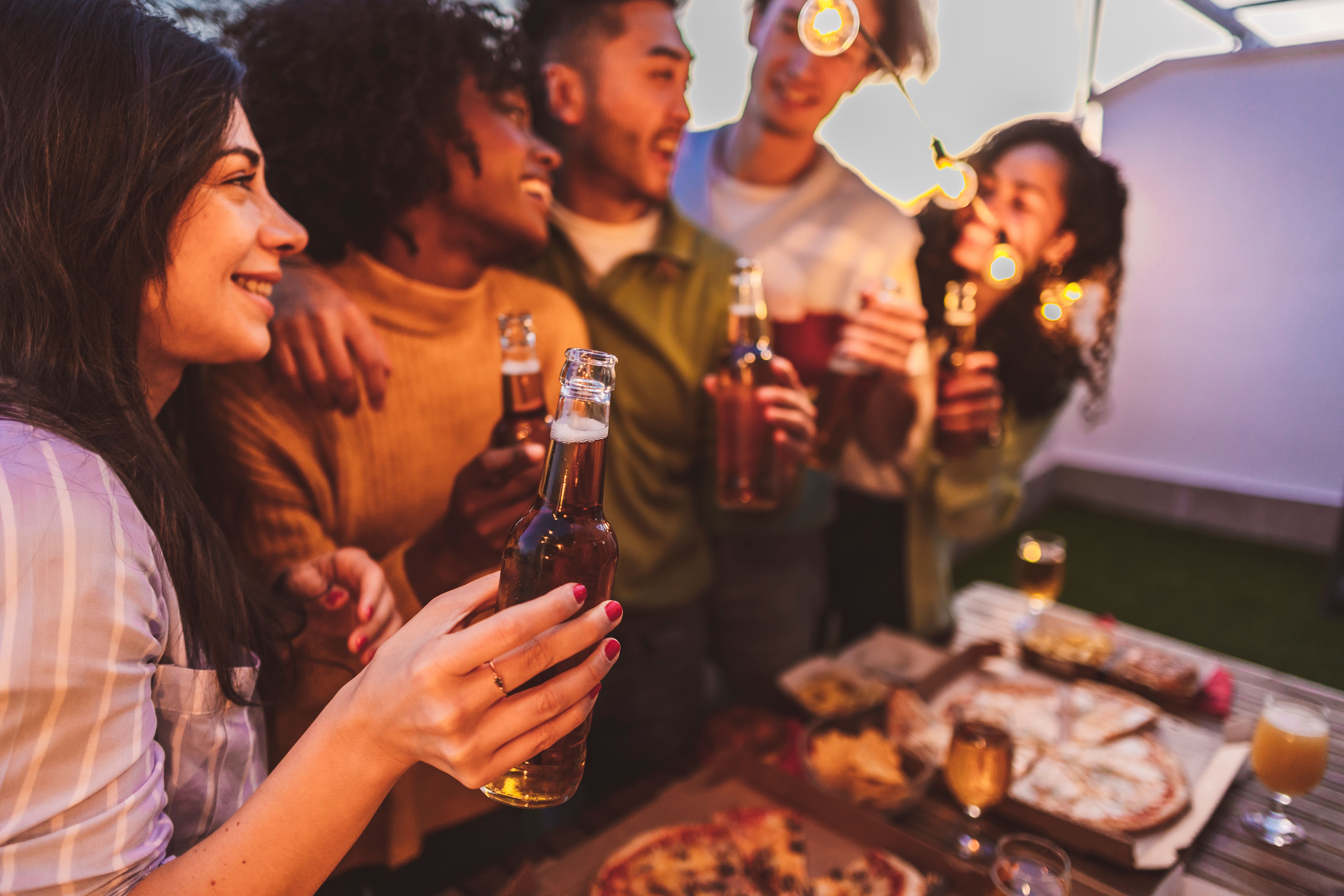 Friends gather with drinks