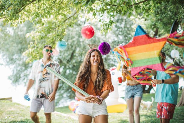 teens around birthday pinata outside