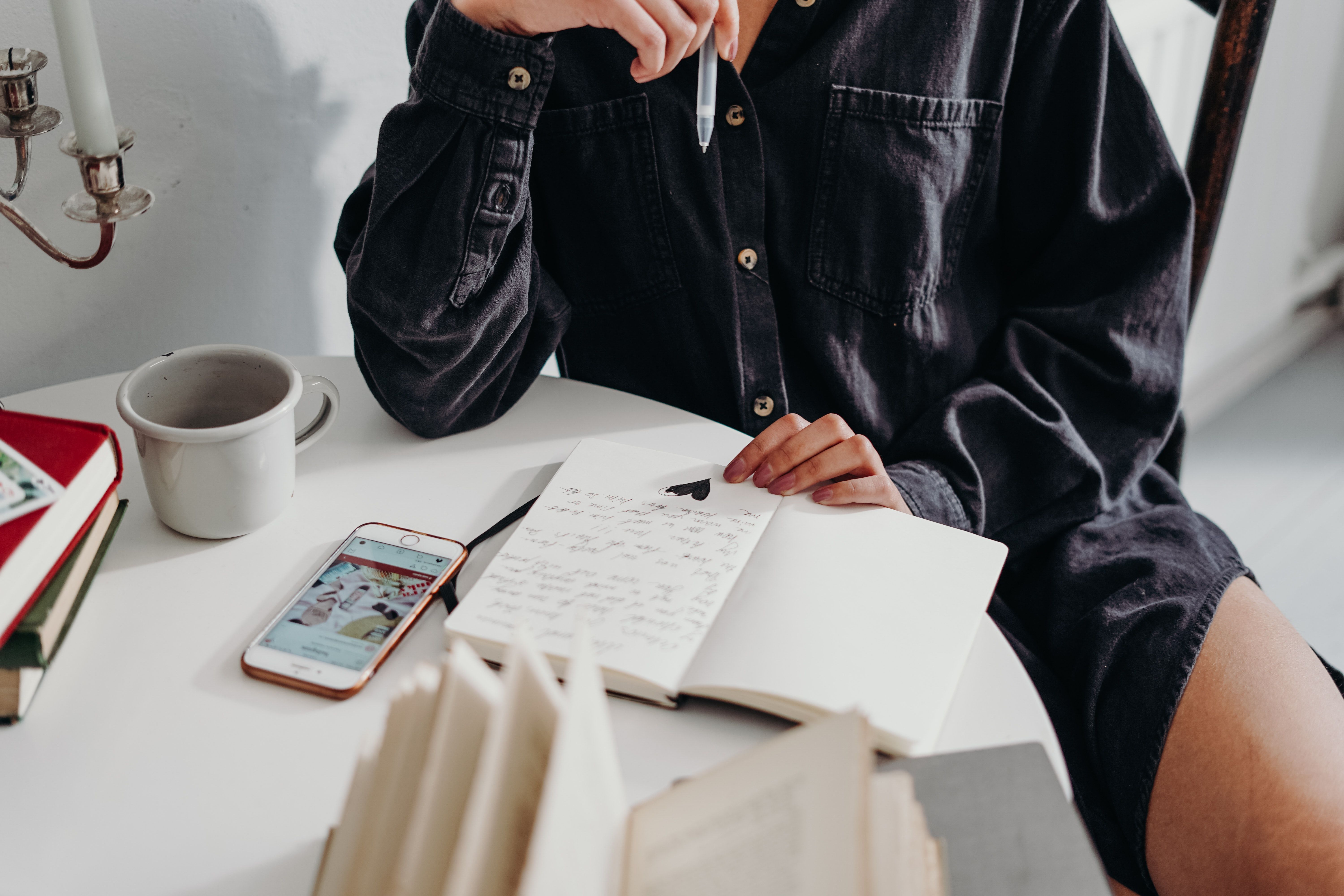 Woman writing in journal